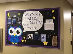 a bulletin board with an owl saying who needs sleep? and stars on the wall