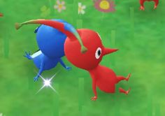 two red and blue animals are in the grass