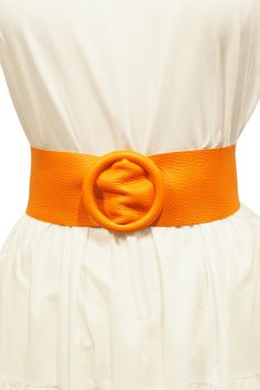 This Italian leather belt is the perfect accessory to add a classic touch to any dress. Embellished with an elegant circular buckle, it's a bold way to show off any dress in style. Let your fashion statement shine with this thick and timeless belt. Please note that since leather is a natural material, each belt can have slight color, texture, grain and size variations. The belt is 43 inches (110 cm) long, 2 1/2 inches (6 cm) wide next to the buckle and 3 inches (8 cm) at the end.  Made in Florence from 100% Italian leather. Chic Adjustable Belt Buckles For Party, Trendy Adjustable Belt Buckles For Party, Trendy Party Belt With Removable Feature, Trendy Party Belt With Removable Buckle, Elegant Belt With Removable Buckle For Spring, Chic Leather Party Belts, Chic Adjustable Belts For Party, Elegant Formal Summer Belts, Trendy Belt Buckles With Matching Belt For Party