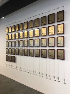 a wall with many plaques mounted on it