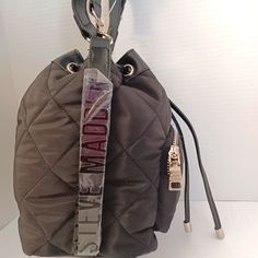 A Rare Find. Black Bucket Style Crossbody Bag. Draw String Closure. Bold Logo On One Side. Removable Strap. Top Handle. A Zipper Pocket Outside On The Front, 1 Zipper Pocket Inside On T Back, And 2 Open On The Inside Front. Steve Madden B Vital Bag, Steve Madden Backpack, Steve Madden Wallet, Steve Madden Purse, Steve Madden Handbags, Black Bucket, Green Purse, Over The Shoulder Bags, Faux Leather Purse