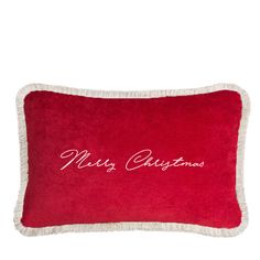 a red pillow with the words merry christmas on it