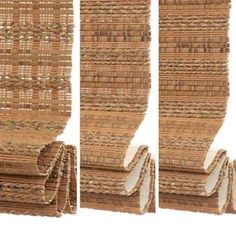 three stacks of bamboo mat stacked on top of each other in different stages of construction