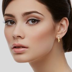 Crafted from exquisite 14K gold, these hoop earrings boast a luxurious radiance that adds a touch of sophistication to any ensemble. The elongated design offers a fresh and modern take on the traditional huggie hoop, making them a statement piece for those who appreciate a chic and updated look. ✪ MATERIAL • 14K Solid Gold (Stamped 14K for Purity Authenticity) • Offered in 14k Yellow, Rose, and White Gold • Available in 2 sizes: 20mm x 12.5mm 14mm x 10mm • 20mm Earrings Weight: 2.84 Grams • 14mm 20mm Earrings, Twisted Hoop Earrings, Chunky Hoop Earrings, Huggie Hoop Earrings, Yellow Rose, Bold Fashion, Elegant Design, Solid Gold, Fine Jewelry