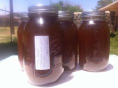 three mason jars sitting on top of a table