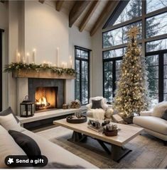 a living room filled with furniture and a christmas tree in front of a fire place