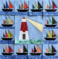 a quilted wall hanging with sailboats and lighthouses in the ocean on it