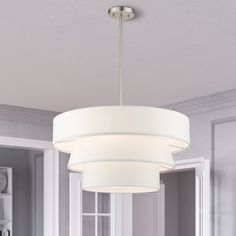 a light fixture hanging from the ceiling in a room with gray walls and white trim