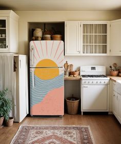 a kitchen with white cabinets and an area rug on the floor next to the refrigerator