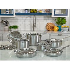 stainless steel pots and pans on a kitchen counter