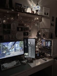 a computer desk topped with two monitors next to a keyboard and mouse on top of a table