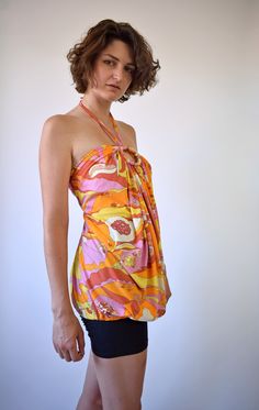 "Psychedelic print top. Made of polyester Halter top is one of a kind vintage piece. In great vintage condition. You will receive the exact item shown in the picture. All the clothes in my shop are washed and stored with care. For reference, model is 5'7\" and measures 32-28,5-36. Wears US size 8, UK size 10, EU size 38. Estimated size: S To be sure it would fit please check measurements below. M E A S U R E M E N T S - taken seam to seam lying flat - not doubled Armpit to armpit 14,5\"=37 cm Le Fitted Summer Tops With Retro Print, Summer Vintage Print Patterned Tops, Summer Beach Top With Vintage Print, Summer Beach Tops With Vintage Print, Vintage Summer Halter Top For Beach, Vintage Summer Beach Halter Top, Spring Vacation Tops With Retro Print, Retro Multicolor Halter Top For Summer, Retro Summer Blouse With Floral Print