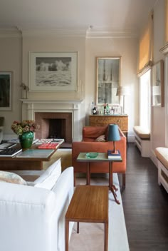 a living room filled with furniture and a fire place