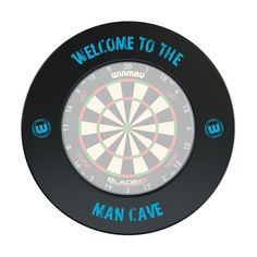 a dart board with the words man cave on it and an arrow in the center