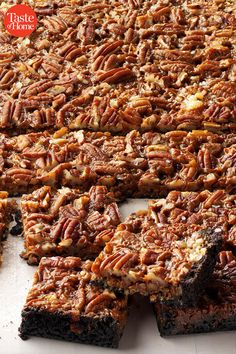 pecan bars cut into squares on a cutting board