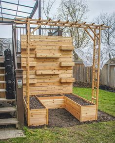 the garden is made out of pallets and has been built into an outdoor structure