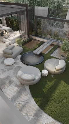 an outdoor living area with grass and white furniture