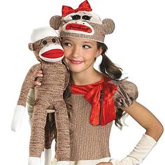 a girl holding two stuffed animals in front of her face with the caption animal's