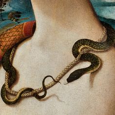 a snake is on the neck of a woman's body, with a painting in the background