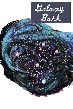 a blue and black scarf with white dots on the bottom, and words galaxy bark above it