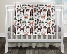 a baby crib bedding set with deer and moose prints