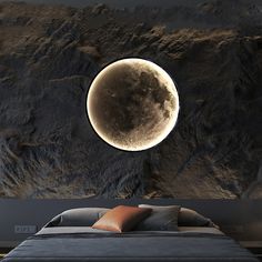 an image of a full moon in the sky above a bed with pillows on it