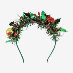 a christmas wreath with holly, mist and ornaments on it's headband is shown against a white background