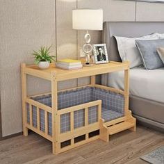 a bed room with a neatly made bed and a night stand next to the bed