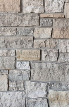 an image of a stone wall that looks like it is made out of different types of stones