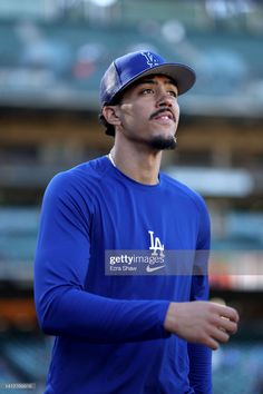 the los angeles dodgers baseball player in blue jersey and cap