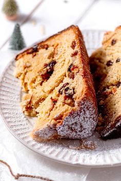 two pieces of cake sitting on top of a white plate