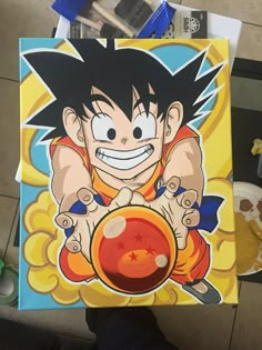 a drawing of gohan holding a red ball