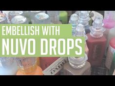 an assortment of nail polish bottles with the words embellish with nuvo drops