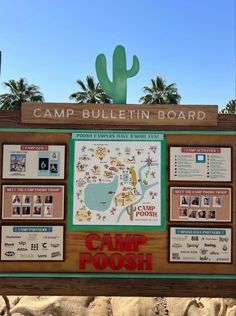 the sign for camp poosh is posted in front of a cactus