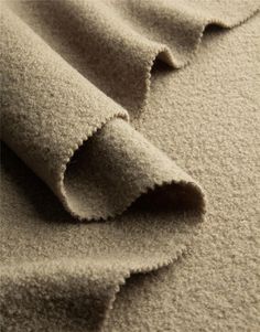 a close up view of the fabric on a bed sheet that has been made to look like sand