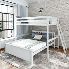 a white bunk bed sitting next to a window