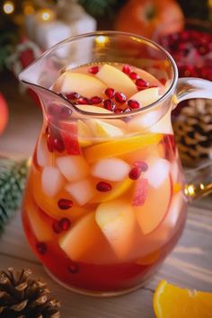 Winter Wonderland Sangria - DineDew Winter White Sangria, Christmas Sangria Recipes Easy, Winter Party Drinks, White Christmas Sangria Recipe, White Christmas Sangria, Winter Sangria Recipes, Holiday Sangria Recipes, Christmas Sangria Recipes, White Sangria Recipe