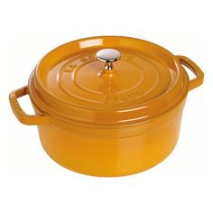 an orange casserole dish with a lid on a white background and no one in it