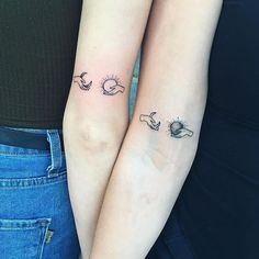 two people with matching tattoos on their arms