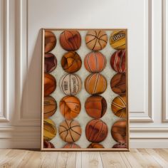 basketballs and balls are arranged in an abstract pattern on a white background with wood flooring