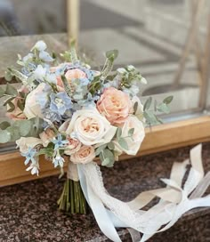 a bridal bouquet sitting on top of a counter