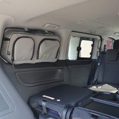 an empty van with luggage in the back