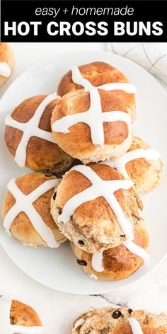 hot cross buns on a plate with white icing