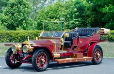 an old fashioned car is parked in a parking lot