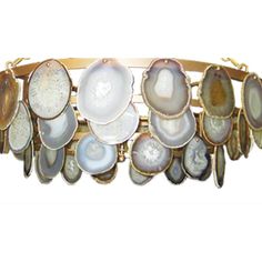 a bracelet with different types of seashells on it