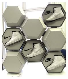 an assortment of nike shoes are arranged in hexagonal boxes to look like hexagons