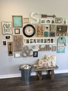 a wall filled with lots of different types of framed pictures and clocks on it's side