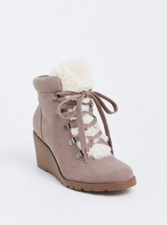 Cozy and cute, these faux suede booties are designed with faux sherpa accents and with a small wedge heel to take you from day to night in style. Our unique fit gives you extra wide width and extra room around your whole foot. EXTRA WIDE WIDTH (WW). Almond toe. Side zip and lace-up closures. Contrast padded faux fur trim. 2. 75” wedge heel. Extra cushioned footbed; textured sole. Man-made materials. Imported extra wide width shoes. The best plus size women's sherpa wedge bootie (ww) flatform & heels in taupe made of suede. Rock your look from Torrid to Festivals like Coachella and Lollapalooza, a concert, a show, or just for fun! Torrid is your destination for cozy fall and winter clothes to keep you warm and comfortable. Winter Suede Wedge Boots With Round Toe, Trendy Synthetic Wedge Boots For Winter, Winter Synthetic Wedge Boots With Round Toe, Winter Suede Boots With Wedge Heel, Suede Wedge Heel Boots For Winter, Suede Wedge Heel Winter Boots, Casual Wedge Heel Boots For Winter, Casual Wedge Boots For Winter, Trendy Winter Boots With Wedge Heel