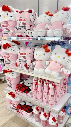 hello kitty stuffed toys are on display in a store