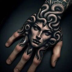 a woman's hand with tattoos on it and an octopus tattooed on the wrist